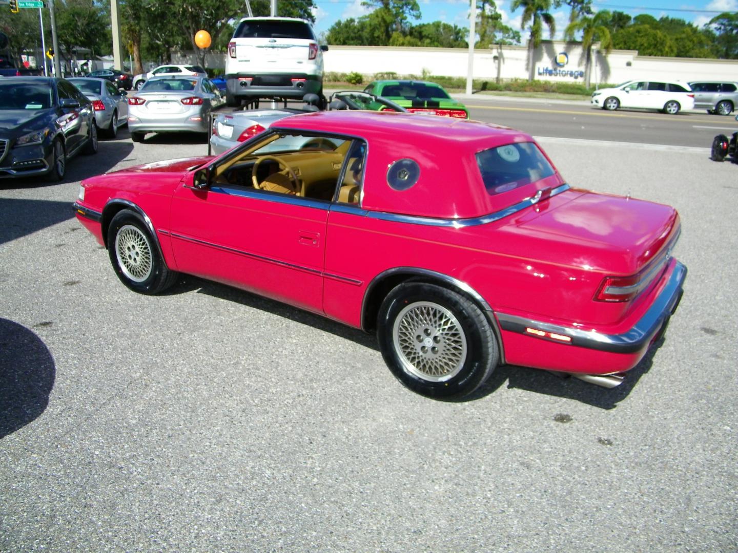 1991 Red /Beige Chrysler TC By Maserati Convertible (ZC2FS1207MB) with an 3.0L V6 SOHC 12V engine, 4-Speed Automatic Overdrive transmission, located at 4000 Bee Ridge Road, Sarasota, FL, 34233, (941) 926-0300, 27.298664, -82.489151 - Photo#3